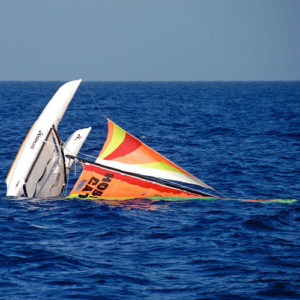 Abandoned catamaran floating in the ocean